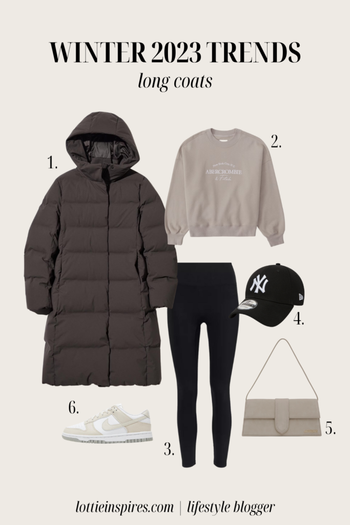 A winter outfit including black leggings, white and beige Nike dunks, beige sweatshirt and a long brown puffer coat.